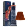 Cutie și tub Wella Koleston Perfect ME+ Vibrant Reds 7/47 de 60 ml, lângă mostra de culoare roșu castaniu
